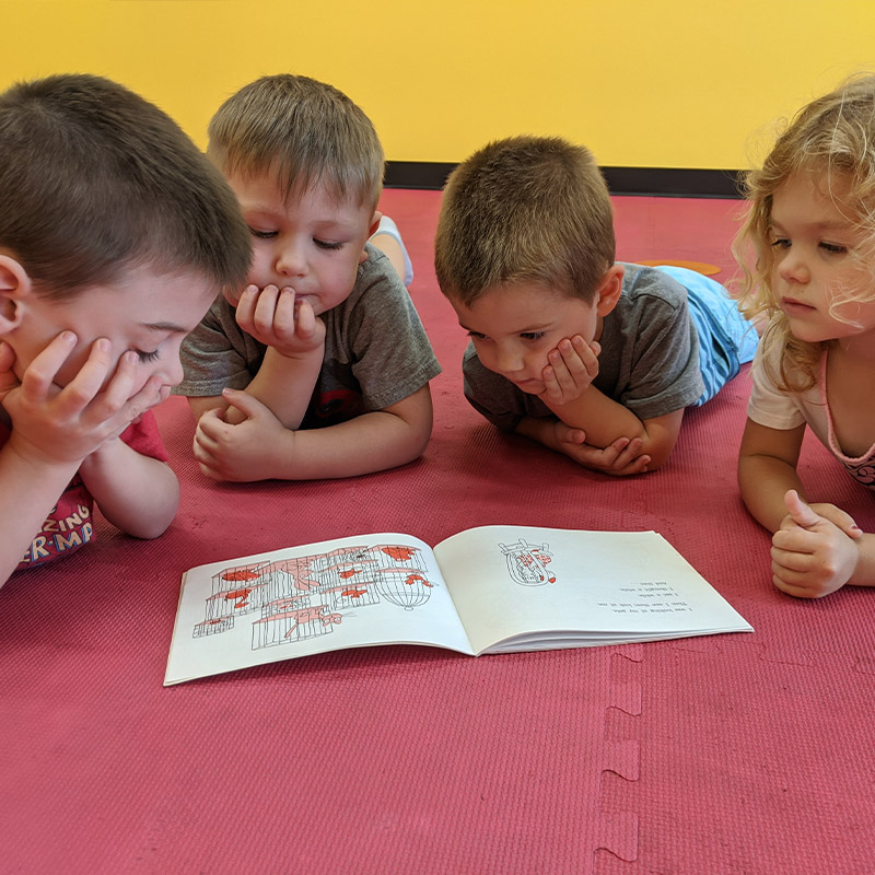 storyplay preschoolers read a book - The Playroom