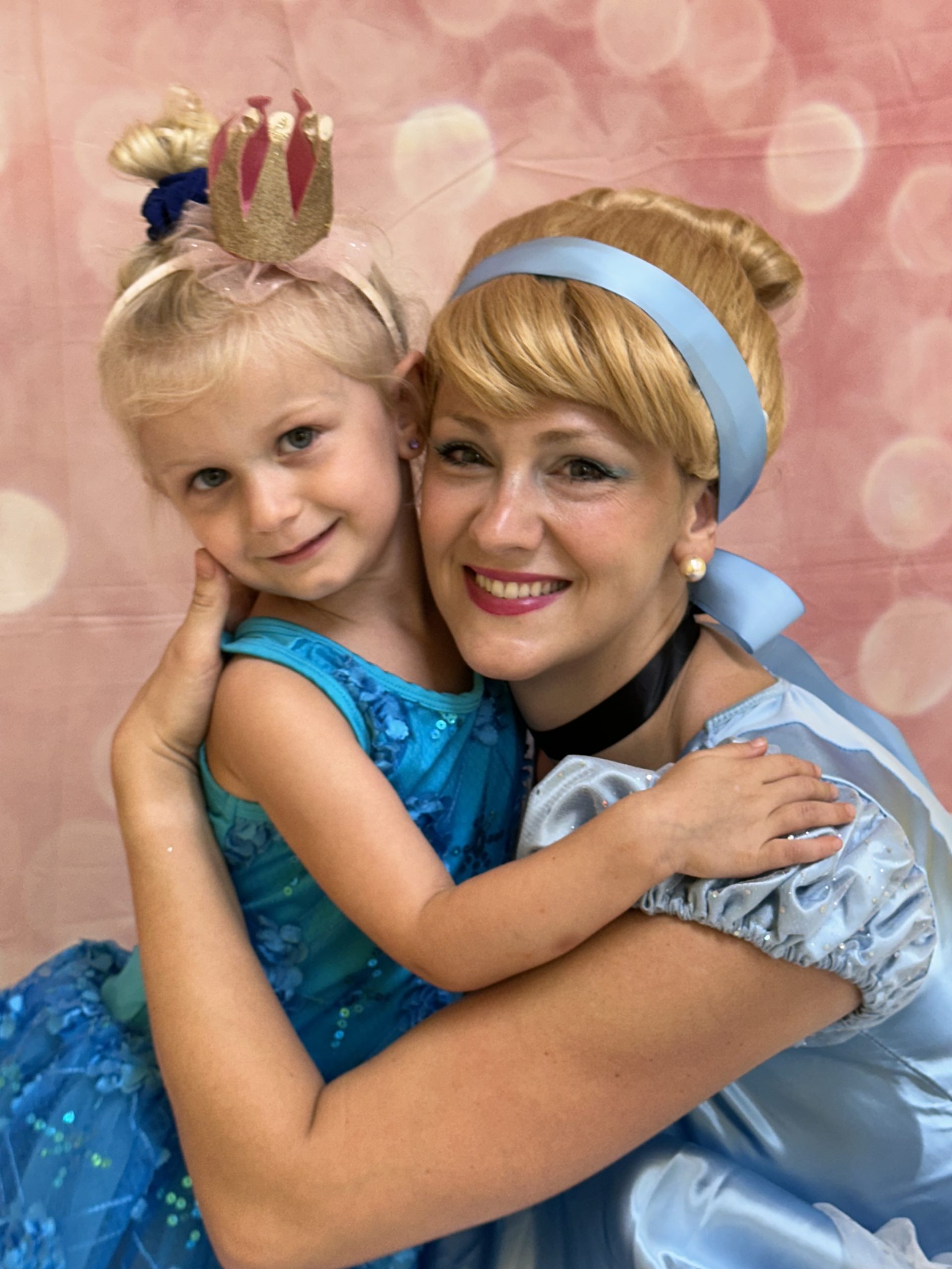 Girl hugs princess Cinderella during Fun Fridays at The Playroom near Bel Air, MD